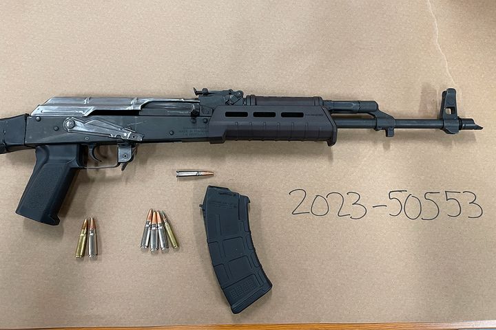 Police surprise pair asleep in stolen car, seize assault rifle